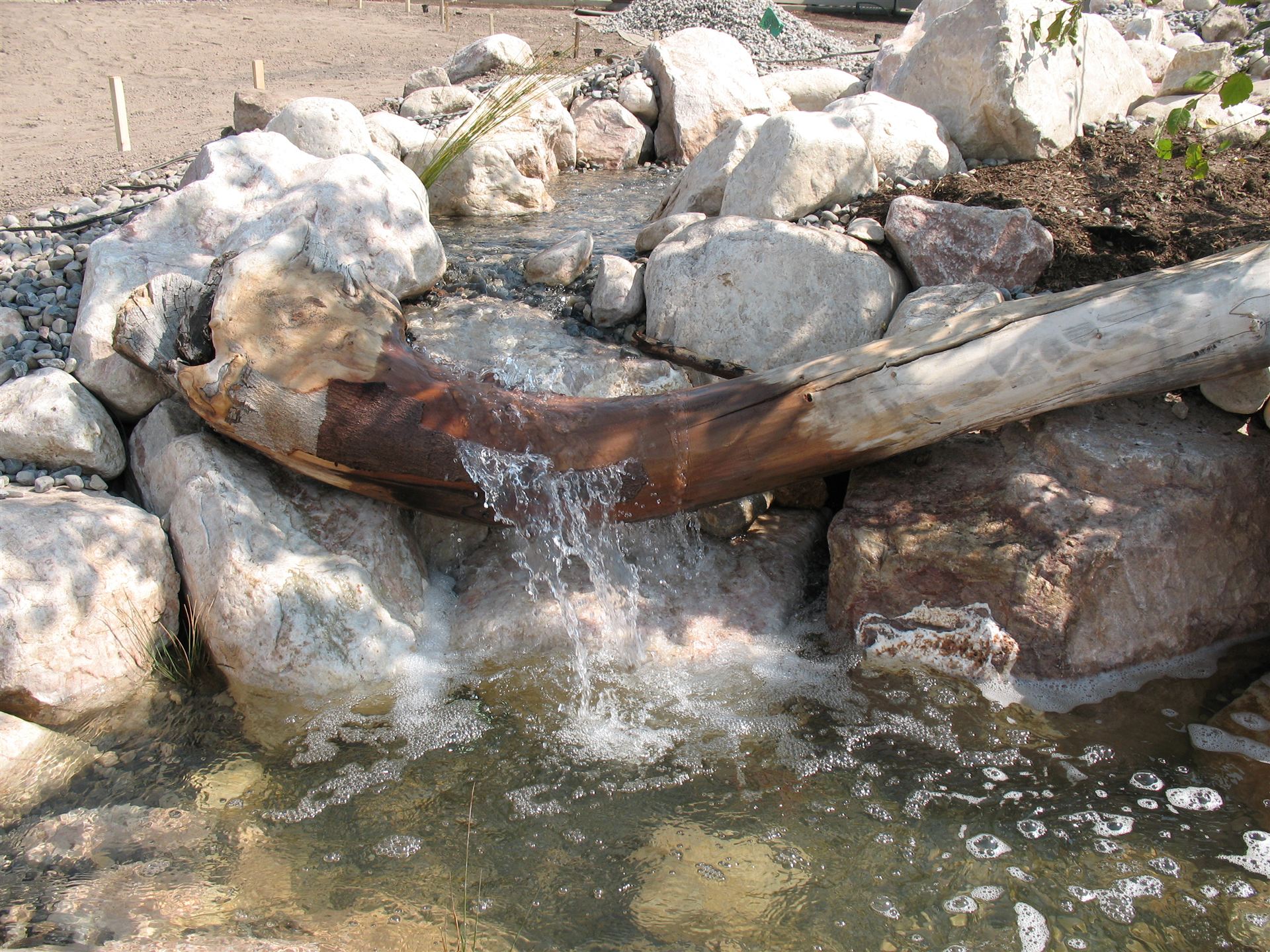 Boulder stream bed with driftwood spillway